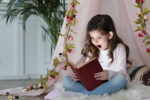 cute-girl-reading-book-around-cute-decoration-min